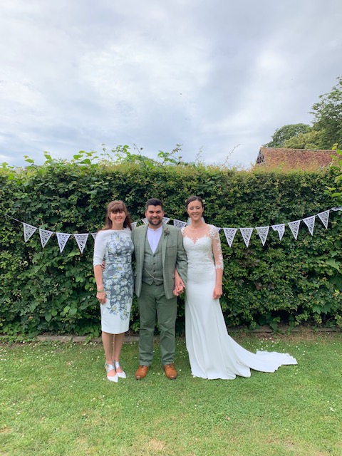 Rachel Head Humanist wedding celebrant with bride and groom in garden for Rachel Head Humanist Wedding Celebrant website